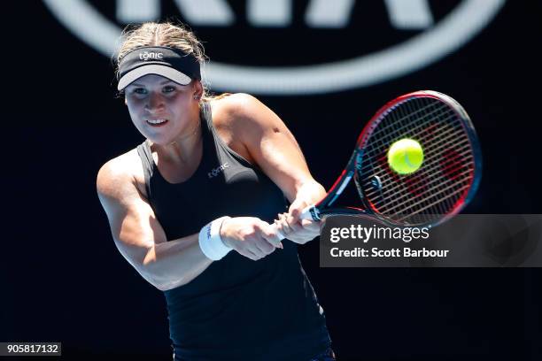 Jana Fett of Croatia plays a backhand in her second round match against Caroline Wozniacki of Denmark on day three of the 2018 Australian Open at...