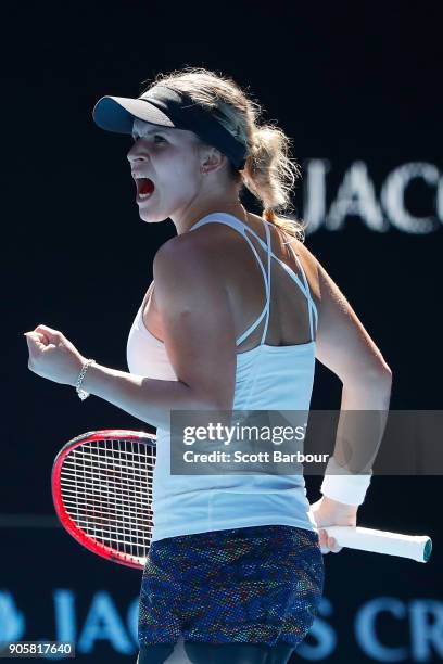 Jana Fett of Croatia celebrates winning a point in her second round match against Caroline Wozniacki of Denmark on day three of the 2018 Australian...