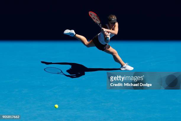Jana Fett of Croatia plays a backhand in her second round match against Caroline Wozniacki of Denmark on day three of the 2018 Australian Open at...