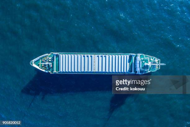 a cargo ship is crossing the ocean. - ship above stock pictures, royalty-free photos & images