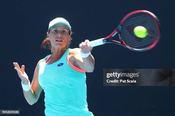 Varvara Lepchenko of the United States plays a forehand in her first round doubles match with Oksana Kalashnikova of Georgia against Qiang Wang of...