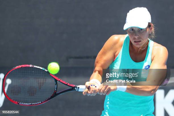 Varvara Lepchenko of the United States plays a backhand in her first round doubles match with Oksana Kalashnikova of Georgia against Qiang Wang of...