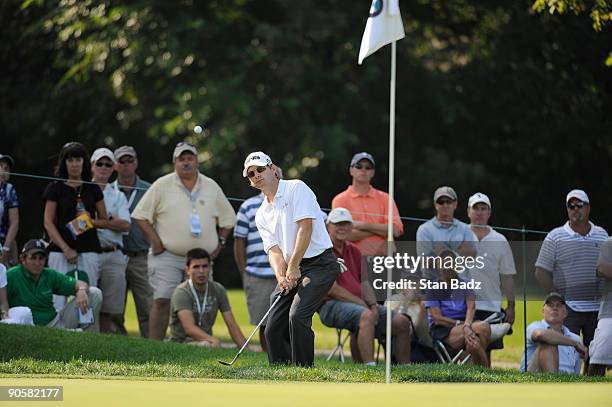 Heath Slocum chips onto the eighth green during the first round of the BMW Championship held at Cog Hill Golf & Country Club on September 10, 2009 in...