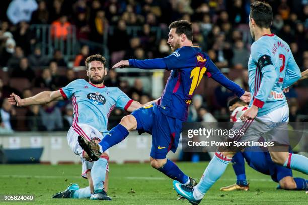 Lionel Andres Messi of FC Barcelona fights for the ball with Sergi Gomez Sola of RC Celta de Vigo during the Copa Del Rey 2017-18 Round of 16 match...