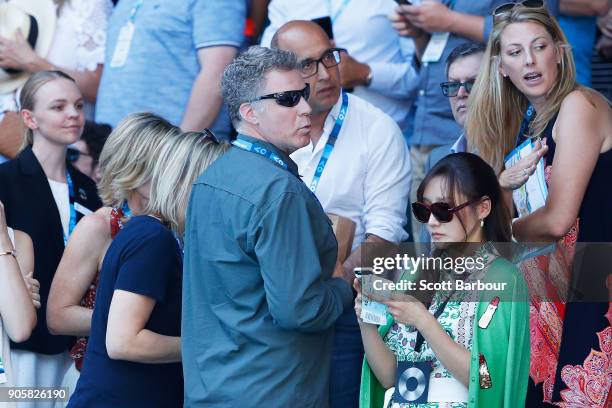 Will Ferrell and his wife Viveca Paulin watch the second round match between Caroline Wozniacki of Denmark and Jana Fett of Croatia on day three of...