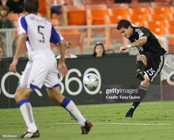 Santino Quaranta of D.C. United sends a shot towards Matt Besler of the Kansas City Wizards during an MLS match at RFK Stadium on September 9, 2009...