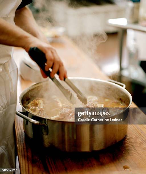 chef cooking a lamb stew - stew pot foto e immagini stock