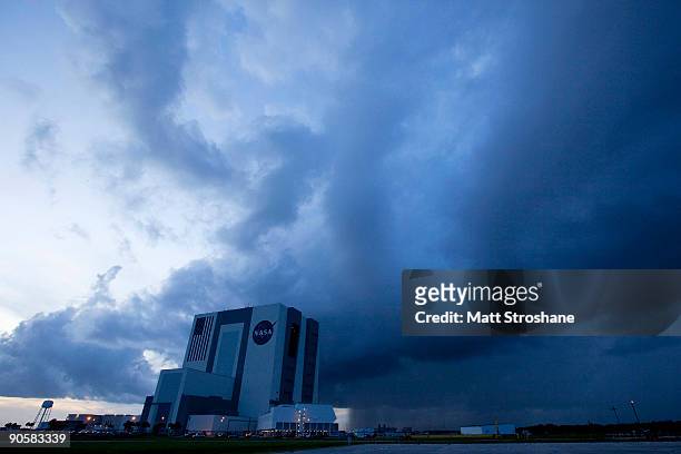 Weather arriving from the Atlantic Ocean pases near NASA's vehicle assembly building, scrubbing Space Shuttle Discovery's return to Kennedy Space...