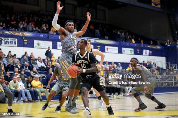 Western Michigan Broncos guard Thomas Wilder drives to the basket as Kent State Golden Flashes center Adonis De La Rosa defends during the first half...