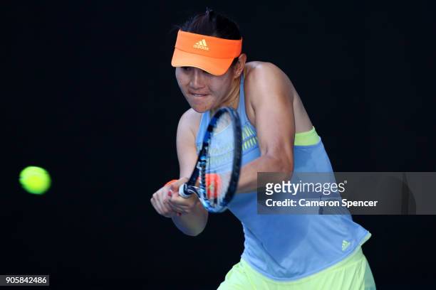 Ying-Ying Duan of China plays a backhand in her second round match against Jelena Ostapenko of Latvia on day three of the 2018 Australian Open at...