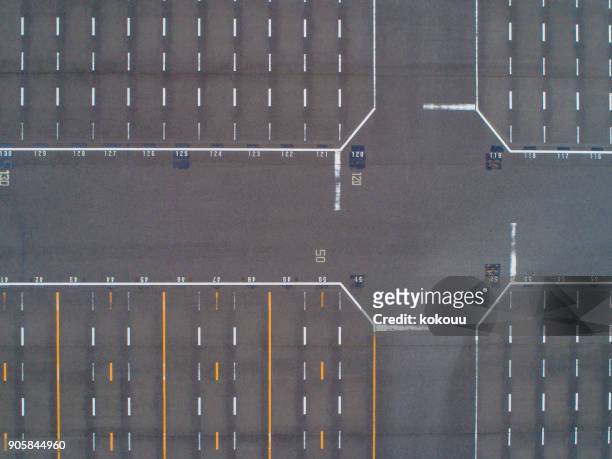 empty parking lots, aerial view. - tarmac airport stock pictures, royalty-free photos & images