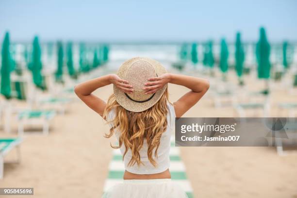 young beautiful woman on beach - jesolo stock pictures, royalty-free photos & images