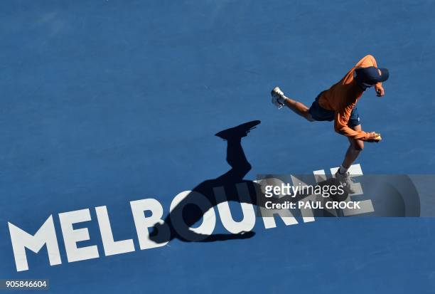 Ballboy runs on court during the men's singles second round match between Spain's Rafael Nadal and Argentina's Leonardo Mayer on day three of the...
