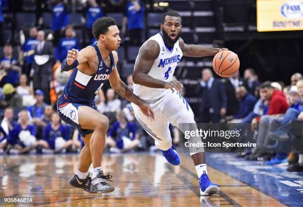 Memphis Tigers Raynere Thornton tries to run past UConn Huskies guard Jalen Adams during the first half of a NCAA college basketball game at FedEx...
