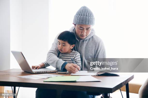 father with son working at home - kids programming home stock pictures, royalty-free photos & images
