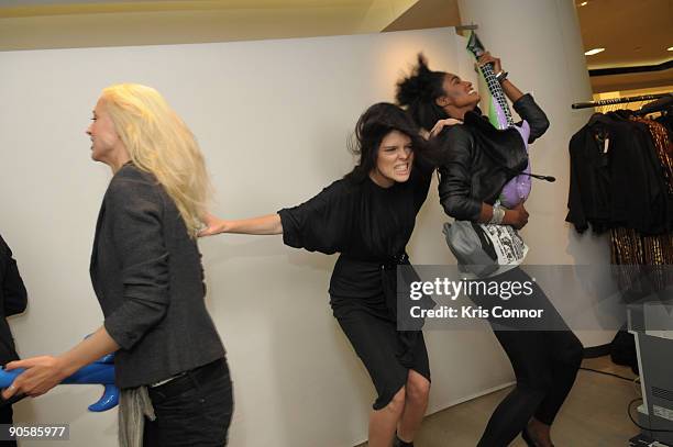 Stylist Edward Enninful, Coco Rocha, Seslie Lopez and Raquel Zimmerman pose during a photo session to create a flipbook during the screening of Coco...