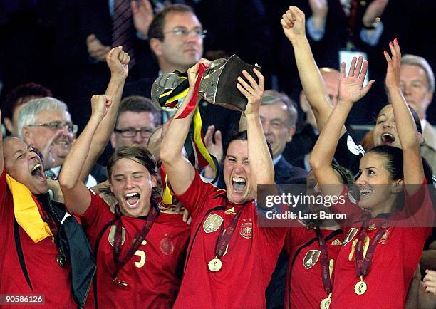 Birgit Prinz of Germany lifts the trophy after winning the UEFA Women's Euro 2009 Final match between England and Germany at the Helsinki Olympic...