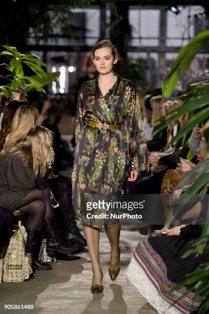 Model runs the runway at the Lena Hoschek Fashion Show at the Botanic Garden during the Berlin Fashion Week in Berlin, Germany on January 16, 2017.