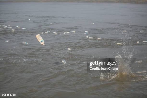 Bottles are being thrown on the sea near the DMZ on January 17, 2018 in Incheon, South Korea. The human rights group organised by North Korean...