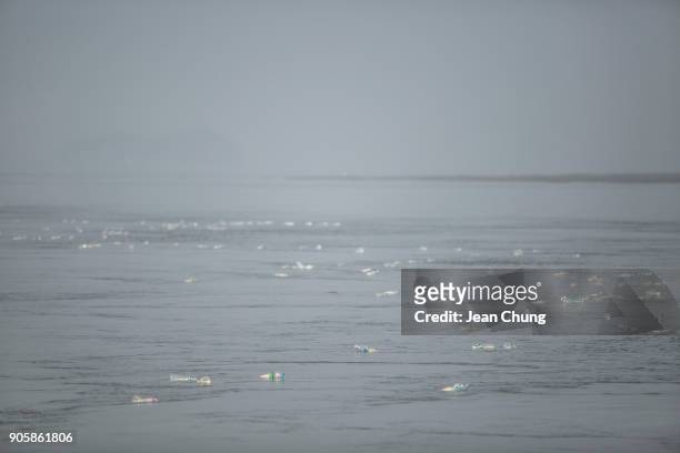 Bottles float on the sea near the DMZ on January 17, 2018 in Incheon, South Korea. The human rights group organised by North Korean defectors in...