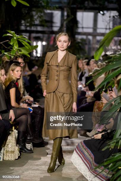 Model runs the runway at the Lena Hoschek Fashion Show at the Botanic Garden during the Berlin Fashion Week in Berlin, Germany on January 16, 2017.