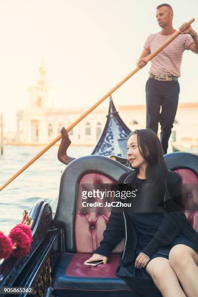 beauty asian girl riding in gondola in venice - gondolier stock pictures, royalty-free photos & images