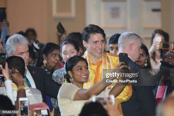 Canadian Prime Minister Justin Trudeau poses for a selfie with a young Tamil woman during the Federal Liberal Caucus Thai Pongal and Tamil Heritage...