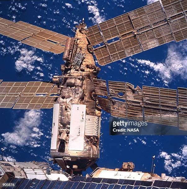 Russia's Mir Space Station's Spektr Module shows the backside of a solar array panel and damage incurred by the impact of a Russian unmanned Progress...