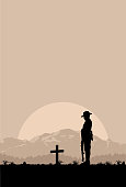 Silhouette of soldier paying tribute at a grave on Anzac day, vector