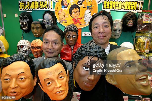 Japanese rubber mask maker Ogawa Rubber Inc. President Hirohisa Ogawa and Executive Director Takahiro Yagihara hold rubber masks of Japanese Prime...
