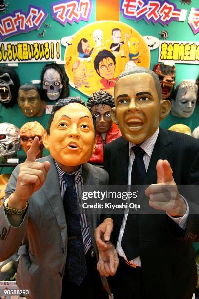 Japanese rubber mask maker Ogawa Rubber Inc. President Hirohisa Ogawa and Executive Director Takahiro Yagihara wear rubber masks of Japanese Prime...