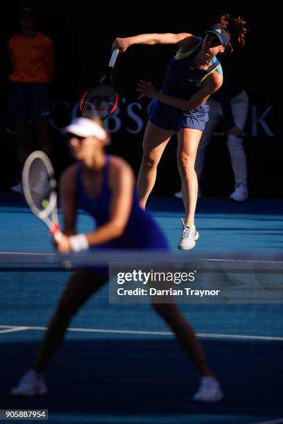 Andrea Petkovic of Germany serves in her first round doubles match with Mirjana Lucic-Baroni of Croatia against Monica Niculescu of Romania and...