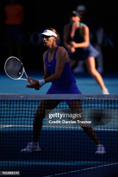 Mirjana Lucic-Baroni of Croatia waits at the net in her first round doubles match with Andrea Petkovic of Germany against Monica Niculescu of Romania...