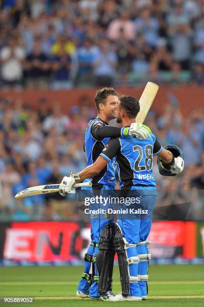 Alex Carey of the Adelaide Strikers celebrates with Jake Weathered of the Adelaide Strikers after reaching his century during the Big Bash League...