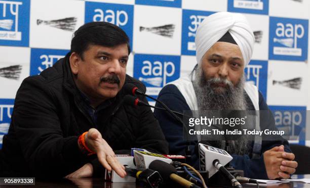 Rajya Sabha MP Sanjay Singh with AAP leader Jarnail Singh addresses a press conference at AAP office in New Delhi.