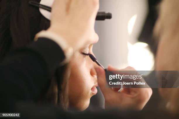 Makeup artists working backstage ahead of the Sportalm show during the MBFW January 2018 at ewerk on January 17, 2018 in Berlin, Germany.