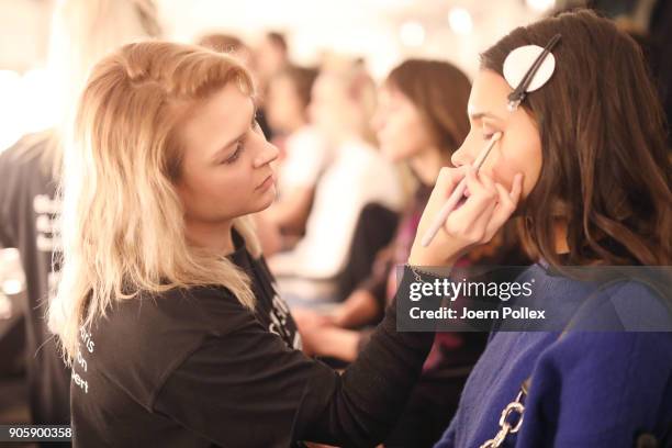 Makeup artists working backstage ahead of the Sportalm show during the MBFW January 2018 at ewerk on January 17, 2018 in Berlin, Germany.