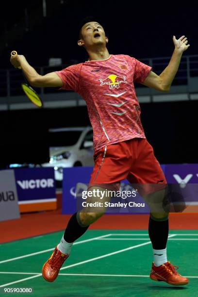 Chen Long of China plays a return shot to Anthony Sinisuka Ginting of Indonesia during the Men Singles round one match of the Perodua Malaysia...