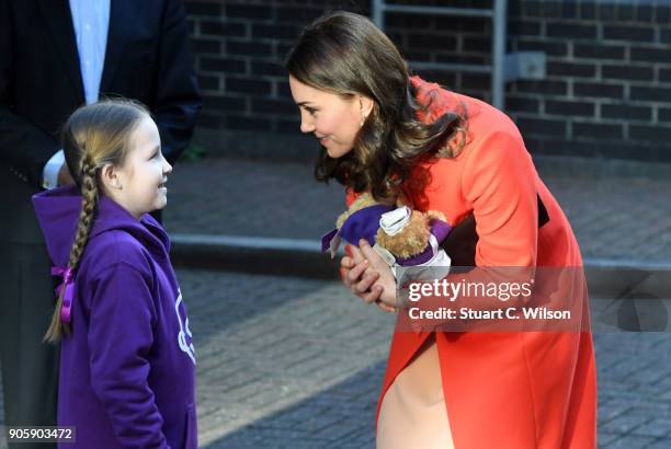 Ava Watt, aged 9 with Cystic fibrosis, presents Catherine, Duchess of Cambridge with a gift during her visit to Great Ormond Street Hospital on...