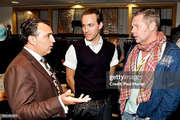 Rag & Bone Designer David Neville talks to guests at the Barneys New York celebration for Fashion's Night Out at Barneys New York on September 10,...