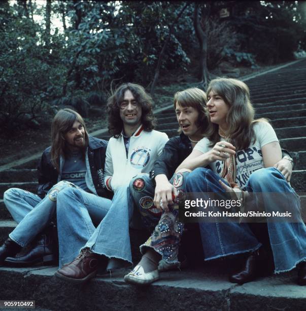 Bad Company, group portrait in a park, March 1975, Tokyo, Japan. Paul Rodgers, Simon Kirke, Mick Ralphs, Boz Burrell.