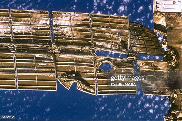 Close-up view of the solar array panel on Russia's Mir Space Station's shows damage incurred by the impact of a Russian unmanned Progress re-supply...