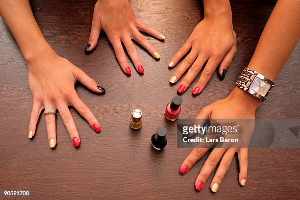 The coloured fingernails of Anja Mittag and Fatmire Bajramaj are seen at the Holiday Inn hotel on September 9, 2009 in Helsinki, Finland.