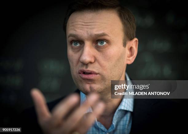 Russian opposition leader Alexei Navalny speaks during an interview with AFP at the office of his Anti-corruption Foundation in Moscow on January 16,...