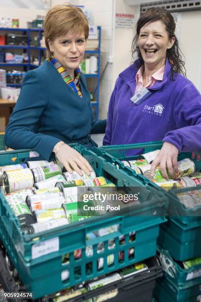 First Minister of Scotland Nicola Sturgeon speaks with volunteer Mary McBride as she visits the Start Up Stirling Food Bank on January 17, 2017 in...