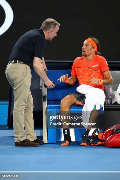 Alexandr Dolgopolov of the UkraineÊtalks to a Grand Slam Supervisor after losing his shoe in his second round match against Matthew Ebden of...