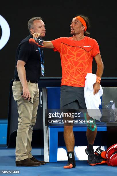 Alexandr Dolgopolov of the UkraineÊtalks to the umpire after losing his shoe in his second round match against Matthew Ebden of Australia on day...