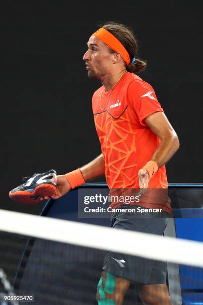 Alexandr Dolgopolov of the UkraineÊtalks to the umpire after losing his shoe in his second round match against Matthew Ebden of Australia on day...