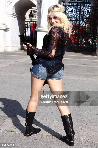 Pixie Lott attends photocall to launch Guitar Hero 5 on September 11, 2009 in London, England.