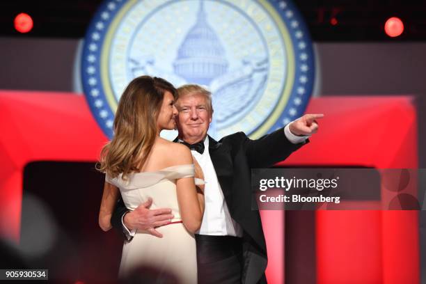 President Donald Trump, right, gestures as he dances with First Lady Melania Trump during the Freedom Ball in Washington, D.C., on Friday, Jan. 20,...